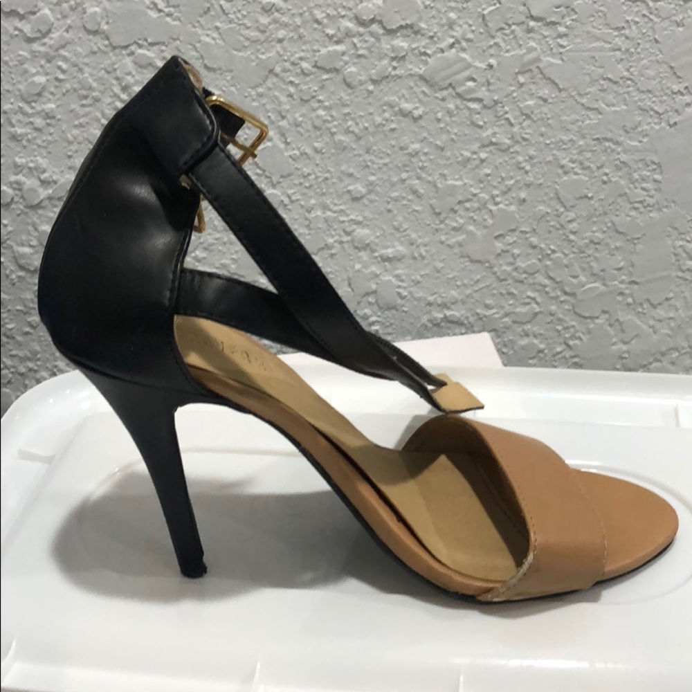 Nude and black strappy heeled sandals